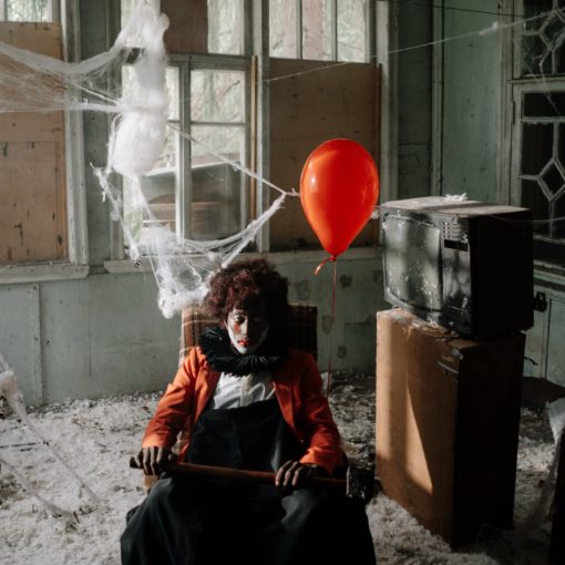 scary clown in an abandoned building