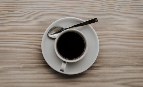 flat lay photo cup of coffee