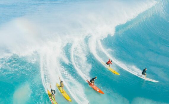 people surfing on sea waves
